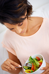 Image showing Food, health and young woman with a salad at home with vegetables for wellness, organic or diet. Top view, nutrition and female person from Mexico eating healthy meal with produce in living room.