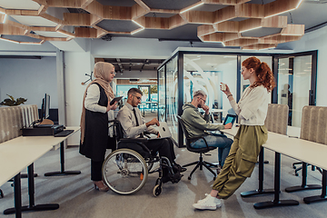 Image showing Young group of business people brainstorming together in a startup space, discussing business projects, investments, and solving challenges.