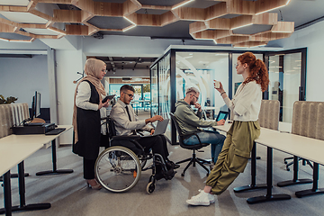 Image showing Young group of business people brainstorming together in a startup space, discussing business projects, investments, and solving challenges.