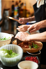 Image showing Mature couple, hands cooking together and healthy food, love and marriage with fresh vegetables in home. Meal prep, old man and woman in kitchen with support, diet and salad for dinner in apartment.