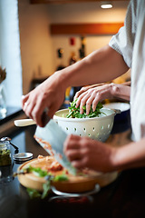 Image showing Couple, hands cooking together and healthy food, love and marriage with fresh vegetables in home. Meal prep, man and woman at kitchen counter with support, diet and salad for dinner in apartment.