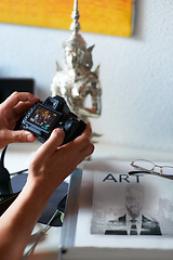 Image showing Camera screen, man or hands of photographer in home with creativity in pictures or photo results. Photography, blog or closeup of man with art after photoshoot production for editing review or memory