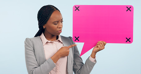 Image showing Speech bubble, mockup and review with a business black woman pointing in studio on a gray background. Space, information or announcement and a young employee holding a sign with tracking markers