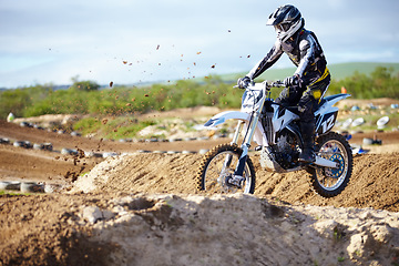 Image showing Man, motorcycle or off road race track jump as professional person in action danger, competition or fearless. Bike rider, transportation or fast speed adventure or rally, extreme sport or challenge