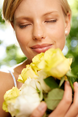 Image showing Relax, smile and woman in garden with roses in bouquet for holiday in spring for outdoor fun. Happiness, freedom and face of girl in park with flowers, weekend in countryside and sunshine on vacation