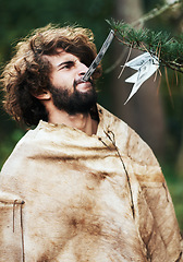 Image showing Nature, confused and caveman at a tree for money, finance, or prehistoric. Frustrated, young and a person or man with a note from a leaf for currency, cash or biting financial wealth in the woods