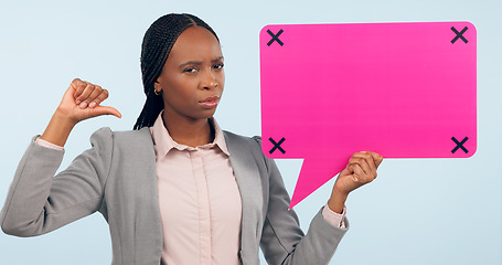 Image showing Portrait, speech bubble and mockup with a business black woman pointing in studio on a gray background. Review, information or announcement and a young employee holding space with tracking markers