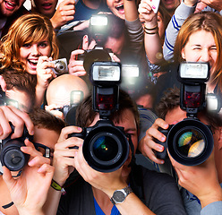 Image showing For the love of celebrity. A group of paparazzi and fans going hysterical - This is a highly retouched image and may not be a good option for a large poster project.