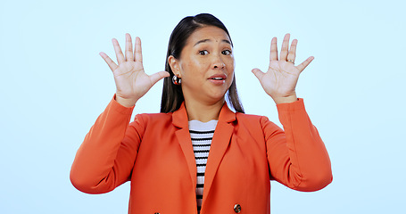 Image showing Portrait, warning and woman with stop, rejection and reaction on a blue studio background. Face, person and model with hand gesture, body language and deny with mockup space, feedback and review