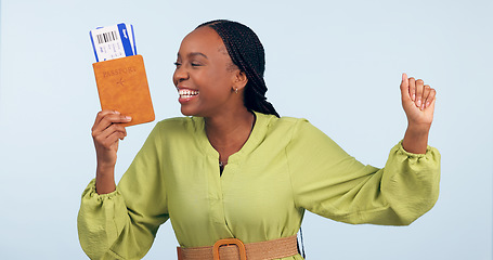 Image showing African woman, passport and studio with fist celebration for airplane ticket, document or excited by blue background. Girl, legal paperwork and win for compliance, immigration or international travel