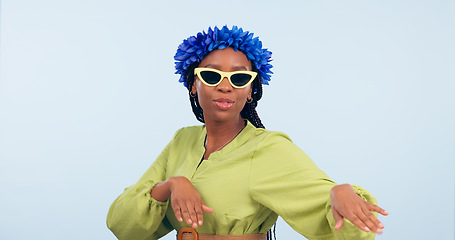 Image showing Woman, dance and fashion for vacation in studio for mockup for offer blue background. African person, happy and sunglasses in portrait for flowers on head for tropical holiday, trip or travel for fun