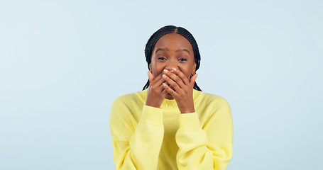 Image showing Covering mouth, wow and portrait of a black woman with a secret, gossip or rumor on a blue background. Shock, happiness and excited African girl with expression of surprise, amazed and good news