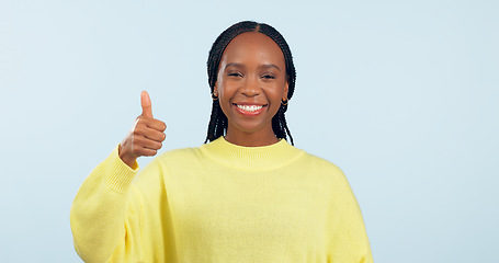 Image showing Portrait, opportunity and black woman with thumbs up, support and decision on a blue studio background. Face, African person and model with hand gesture, sign and feedback with review and emoji