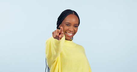 Image showing Pointing to you, motivation and black woman with opportunity, choice and announcement on a blue studio background. African person, model or girl with hand gesture, mockup space and feedback with news