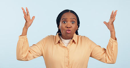 Image showing Woman, shocked and hands up with question in studio for mockup of announce, wtf and alarm on blue background. Female model, expression and portrait for news, why and surprise on face with gesture