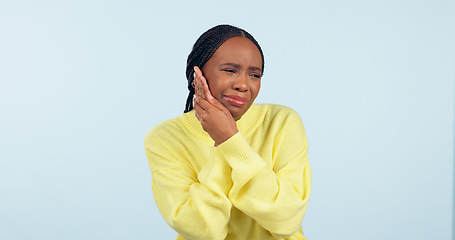Image showing Black woman, toothache and inflammation with pain, unhappy and uncomfortable on isolated studio background. Dental problem, teeth and mouth for cavity, sore and pressure with hands, gums or infection