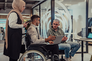 Image showing Young group of business people brainstorming together in a startup space, discussing business projects, investments, and solving challenges.