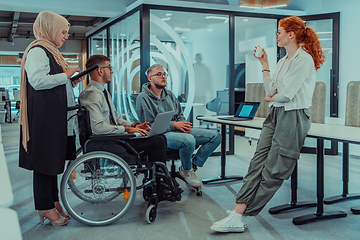 Image showing Young group of business people brainstorming together in a startup space, discussing business projects, investments, and solving challenges.