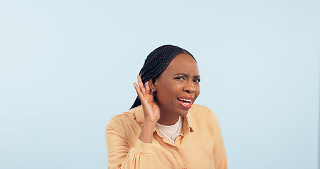 Image showing Woman, hand and ear in studio for gossip, story and frustrated face in portrait by blue background. African girl, hearing and confused for secret information, news and communication with questions