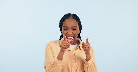 Image showing Happy woman, smile and pointing at you with hand in studio for choice, yes or decision in mockup on blue background. African girl, gesture or excited of announcement of new job, hiring or opportunity