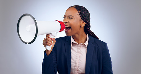 Image showing Megaphone, speech and screaming business woman in studio for change, transformation or freedom on grey background. Corporate, justice and female speaker with bullhorn noise for announcement attention