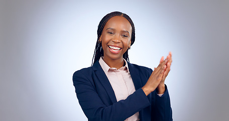 Image showing Business, success and face of black woman with applause in studio with congratulations, pride or praise on grey background. Portrait, smile or lady entrepreneur with clapping hands emoji motivation