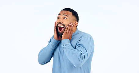 Image showing News, announcement and man with surprise on face in studio, white background or mockup space. Wow, emoji and excited or happy person with secret, drama or hearing crazy information on promotion