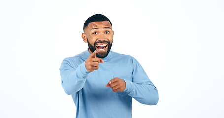 Image showing Portrait, man and pointing in studio with smile for motivation, selection and encouragement on white background. Face, person and hand gesture with happiness for decision or choice with mock up space
