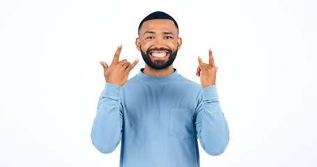 Image showing Happy man, rocker and hands with smile in studio with portrait for mockup on white background. Male model, face and excited in freedom, fun or party for energy of music, sign or punk gesture in space