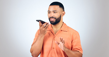 Image showing Man in studio with voice phone call, smile and talking with connection for networking, online chat or communication. Happiness, discussion and person with smartphone conversation on white background.