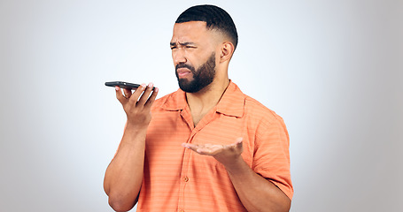 Image showing Man in studio with phone, voice call and frustrated with connection problem for communication. Discussion, anger and confused person on smartphone conversation, scam or phishing on white background.
