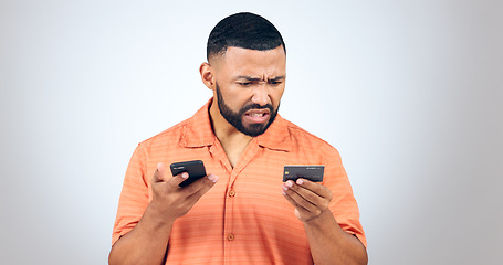 Image showing Man in studio with phone, credit card and frustrated with connection problem, debt or glitch. Fintech, anger or confused person with smartphone for banking, online shopping or 404 on white background