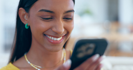 Image showing Happy, Indian woman and reading social media with phone in home with funny meme, post or blog online. Internet, search and communication with cellphone to chat, contact or network with a smile