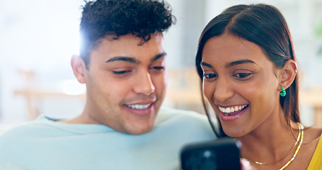 Image showing Couple, phone and relax on sofa, laugh or reading for funny story, notification or post on web blog. Man, woman and smartphone for meme, streaming comic video or happy on social network app in home