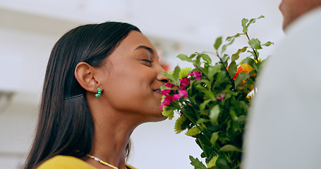 Image showing Home, gift and woman smell flowers with a smile on valentines day, anniversary or surprise from partner. Happy, wife or girlfriend with flower bouquet, present and enjoying floral scent in house