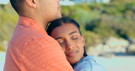 Image showing Couple, hug and beach on relax holiday with love, support and travel with marriage and vacation. Summer, adventure and calm outdoor with a woman and man together by the ocean with touch and embrace