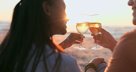 Image showing Sunshine, beach and couple with wine, toast and anniversary with happiness, marriage or vacation. Romance, man or woman with alcohol, cheers or relationship with seaside holiday, lens flare or summer