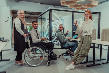 Image showing Young group of business people brainstorming together in a startup space, discussing business projects, investments, and solving challenges.