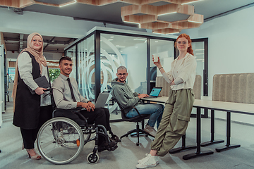 Image showing Young group of business people brainstorming together in a startup space, discussing business projects, investments, and solving challenges.