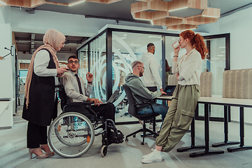 Image showing Young group of business people brainstorming together in a startup space, discussing business projects, investments, and solving challenges.