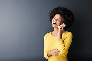 Image showing Black woman, laughing and happy phone call, communication or connection in studio background. African, face or person in funny mobile conversation with joke or listening to contact talking with humor