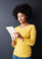 Image showing Black woman, reading and tablet with social media, app or chat with internet communication. Streaming, online and person with tech for watching a video, post or research with web connectivity