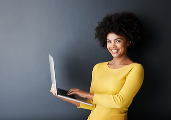Image showing Online class, work and portrait of black woman with laptop, mockup and happiness in studio background. Computer, research and college student typing on keyboard for working, project or e learning