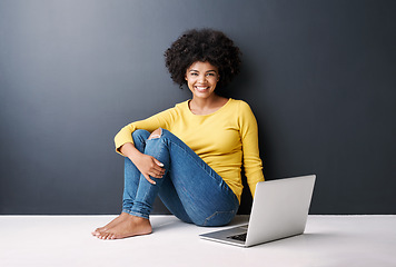 Image showing Online class, work and portrait of black woman with laptop, mockup and happiness on floor in studio background. Computer, research or college student typing on keyboard for work, project or elearning