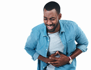 Image showing Sick, black man and stomach pain from food poisoning, virus or ibs gas in studio or white background. Medical, problem and digestion ache in colon with health emergency or diarrhea in mockup space