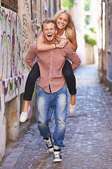 Image showing Couple, happy or piggyback on street in city, fun support or romance in committed relationship. Excited man, woman and smile for adventure in amsterdam, travel and care for love together on honeymoon