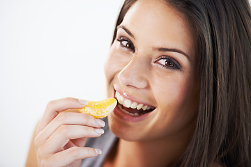 Image showing Healthy, diet and portrait of woman with orange in studio for detox, care or gut health promo on white background. Face, smile and model with fruit for weight loss, wellness or vitamin c nutrition