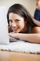 Image showing Relax, laptop or portrait of happy woman in e learning, online education or typing for university at home. Remote work, floor or student on computer to research info or report on a college website