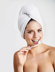 Image showing Woman, portrait and toothbrush for dental hygiene, teeth whitening and healthcare for gums in studio. Happy female person, smile and cleaning mouth for protection, brushing and white background