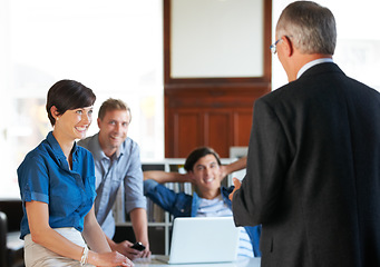 Image showing Business meeting, men and woman with smile for planning, strategy or brainstorming with partnership, collaboration or technology. Employees, people and presentation in office at workplace or company